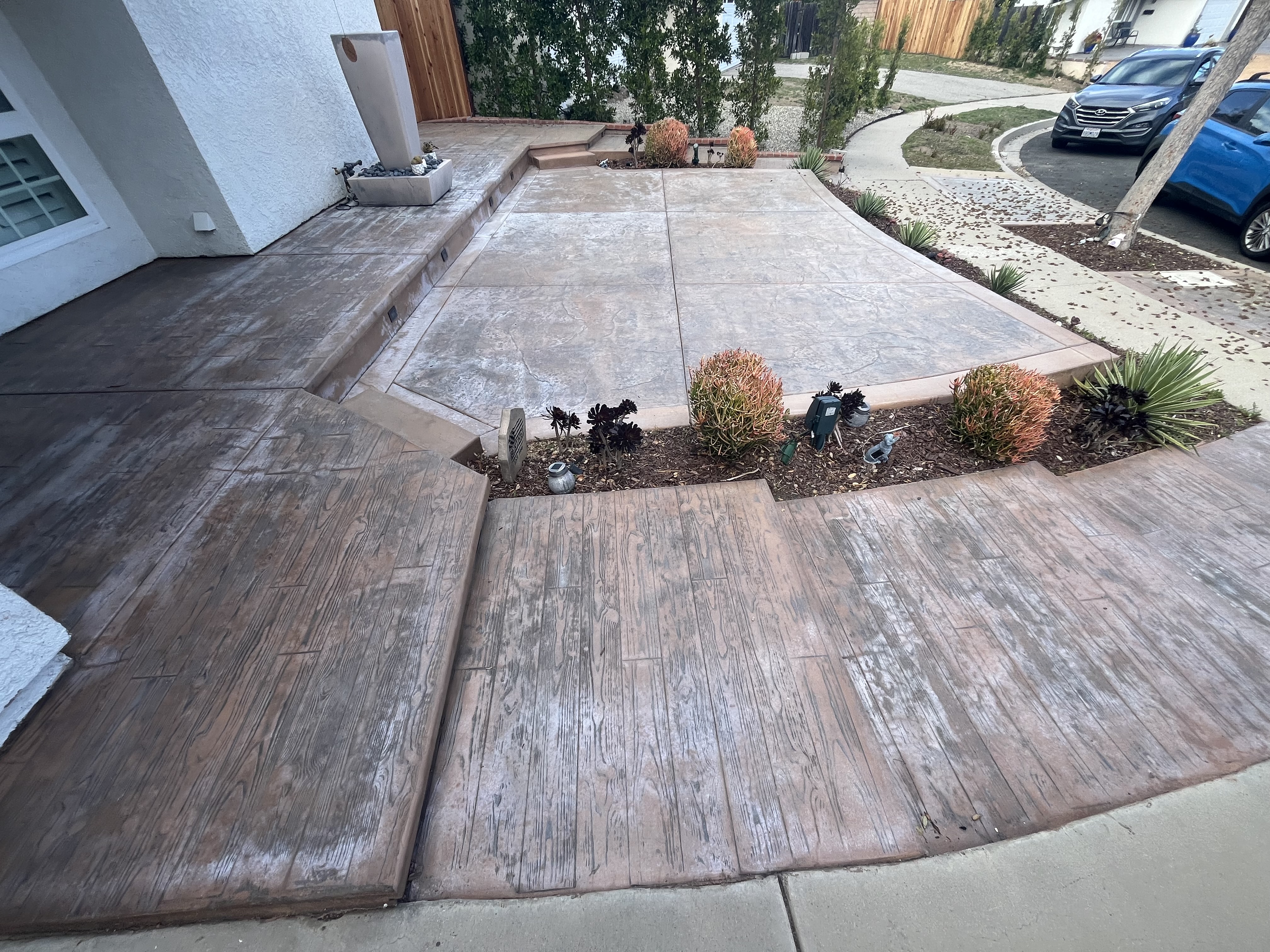 Brick border driveway with stone veneer facade